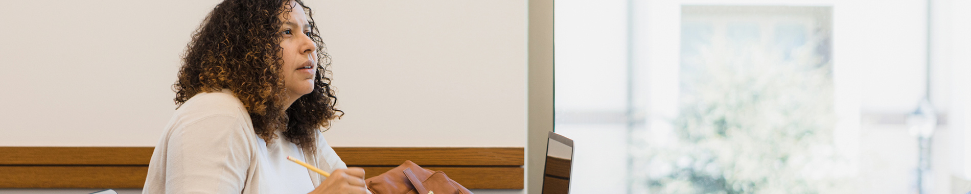 woman sitting at desk with laptop