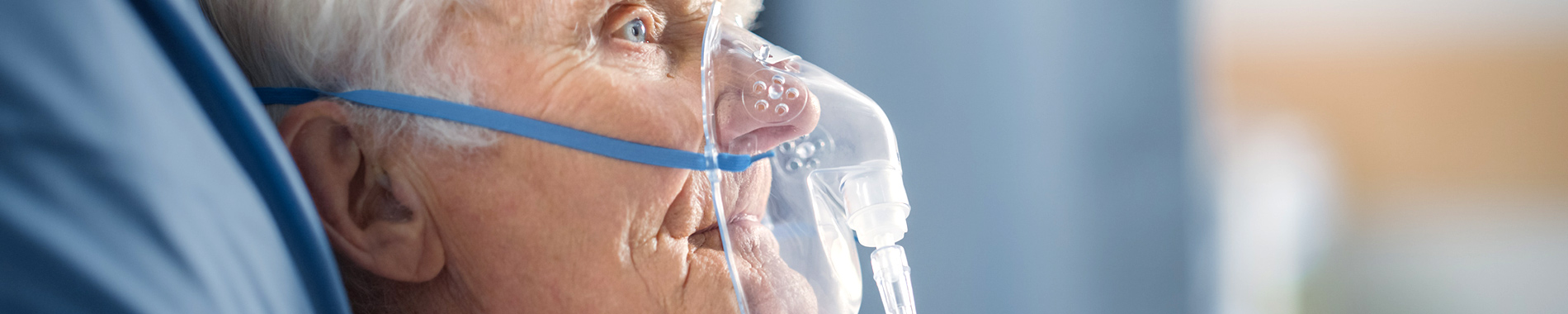 elderly man wearing oxygen mask