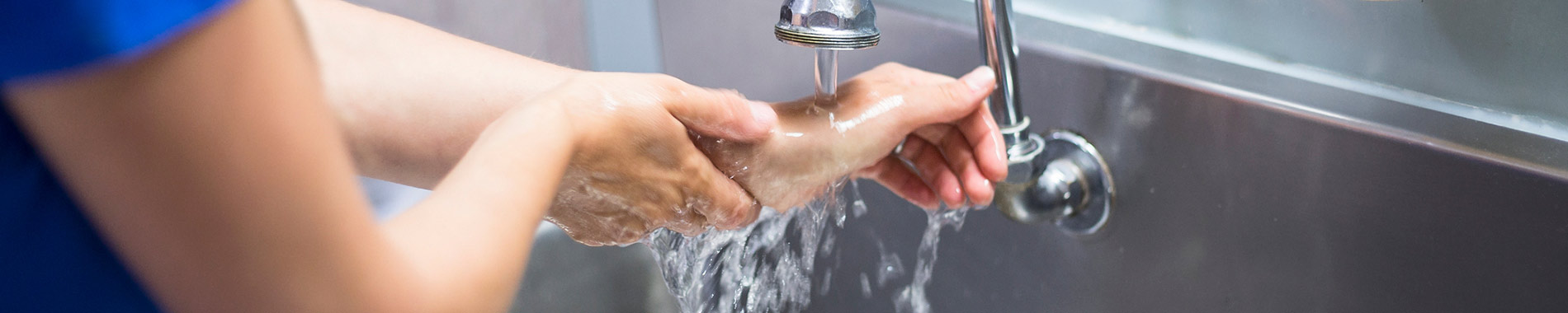 female nurse washing hands