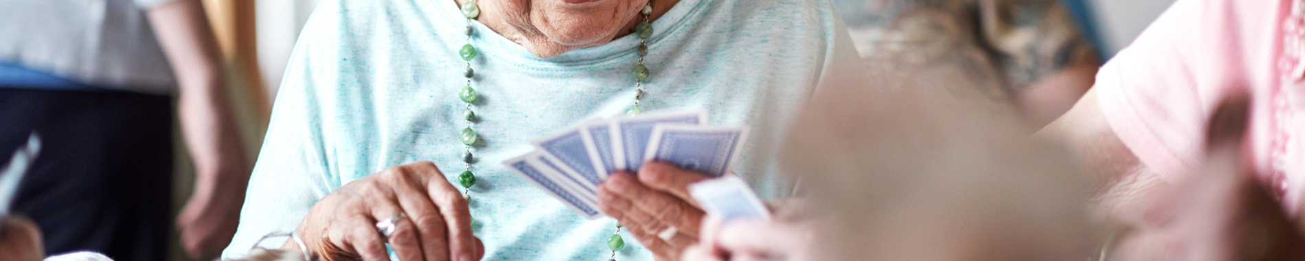 elderly women playing cards