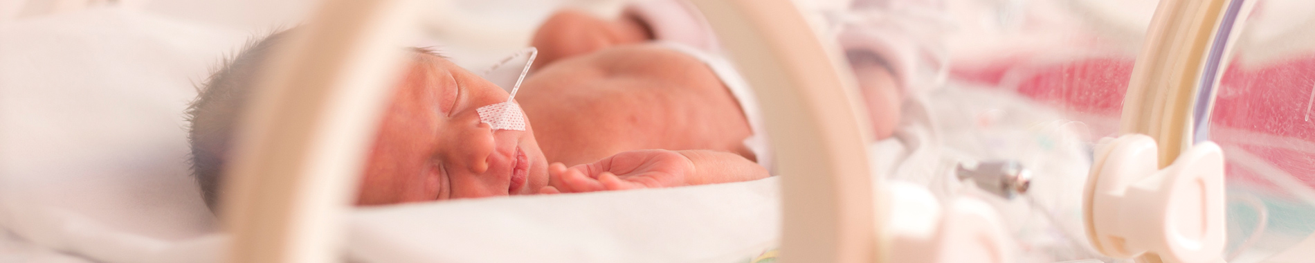 baby lying in incubator