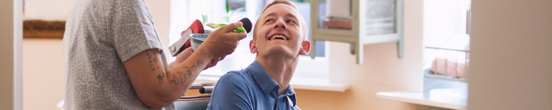 man in wheelchair laughing