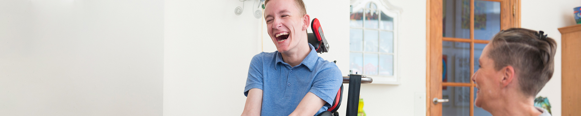 man in wheelchair laughing