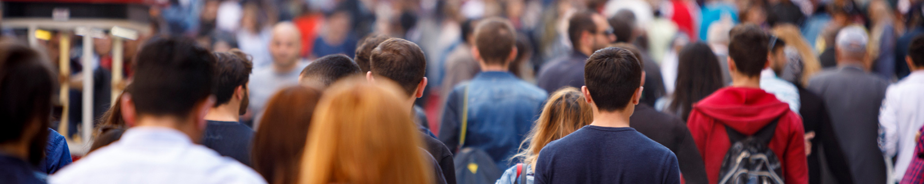 crowd of people walking along the street