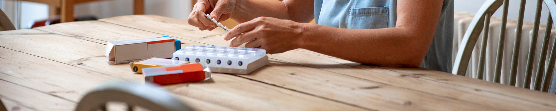 woman organizing daily tablets