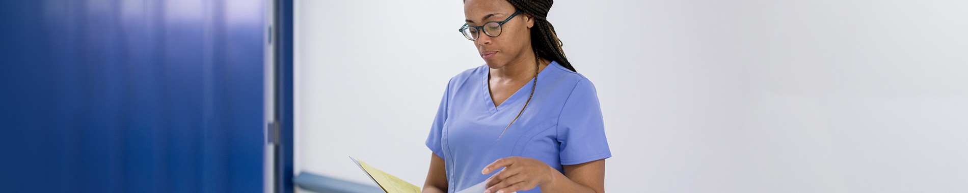 nurse looking at patient file