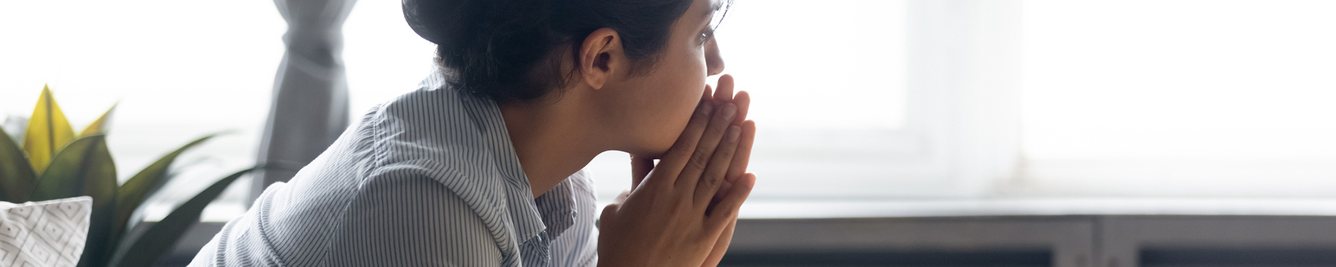 woman looking out of window