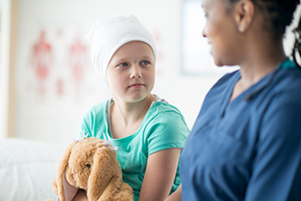 Nurse talking to young patient