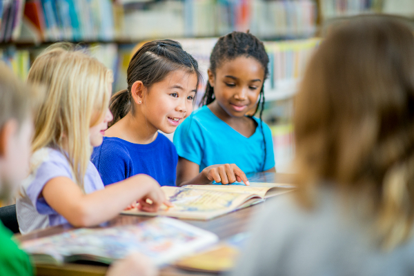 School nurse talking to young girl