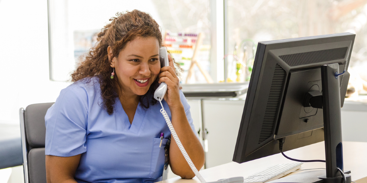 Nurse-on-phone-at-desk