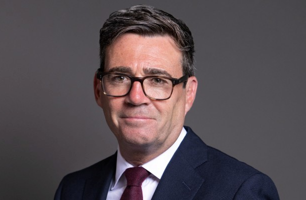 headshot of UK prime minister Andy Burnham wearing a suit and tie 