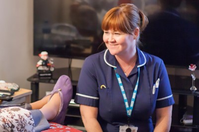 Nurse smiling at patient