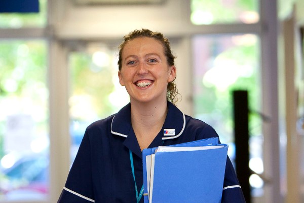 A Nurse holding a folder