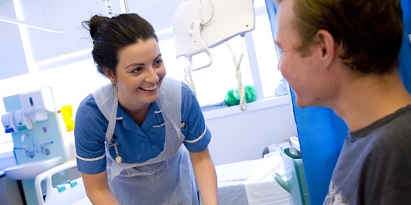 Emergency care nurse talking to a patient