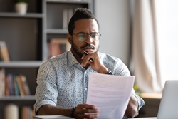 Image of man reading contract