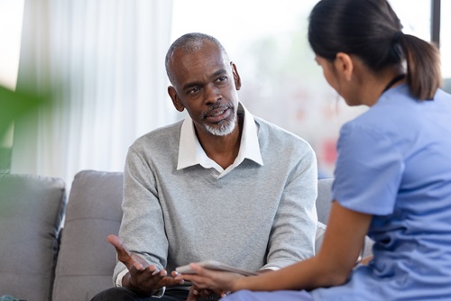 Nurse listening to patient