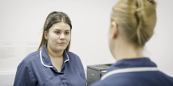 Two nurses having a conversation