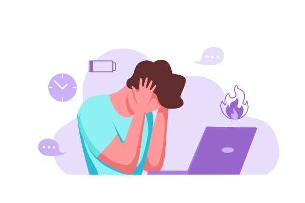 A man suffering from burnout at his laptop