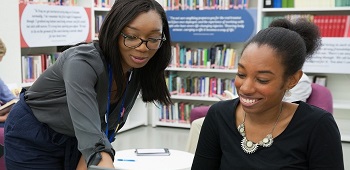 Two people in a library