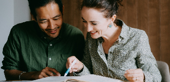 man sitting behind weighing scale