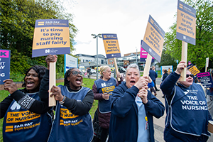 A group of nursing staff holding signs at a 'Fair pay for nursing' demonstration