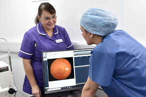 Two member of nursing staff looking at a screen