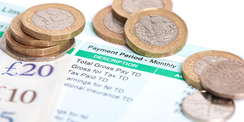 payslip and coins