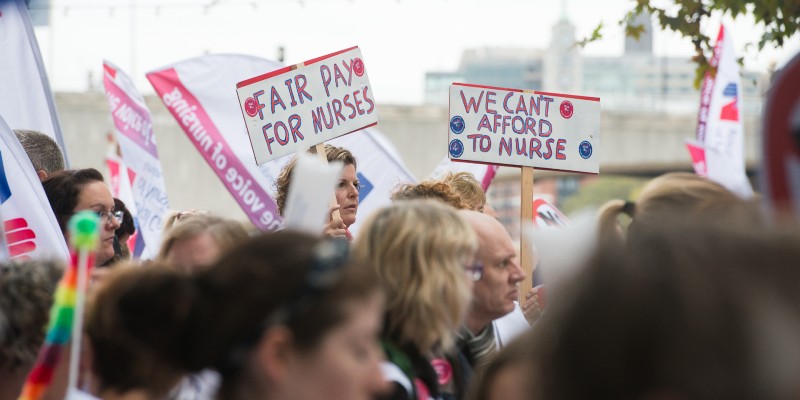 People at fair pay rally