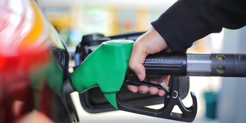 Close up of hand holding petrol pump