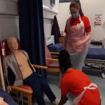 Two cadets working together in a clinical setting.