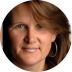 A headshot of Lucy Tomlins