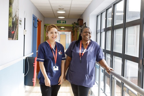 Registered nurse standing in ward