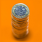 Immigration Health Surcharge Image of a stack of pound coins