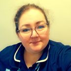 A photo of RCN Yorkshire & the Humber Board member Lisa Cooke smiling. Lisa is in a navy blue nurse uniform,