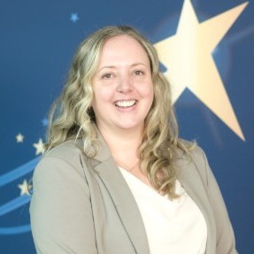 A headshot photograph of Sarah Jackson against the RCN Awards blue background with golden stars