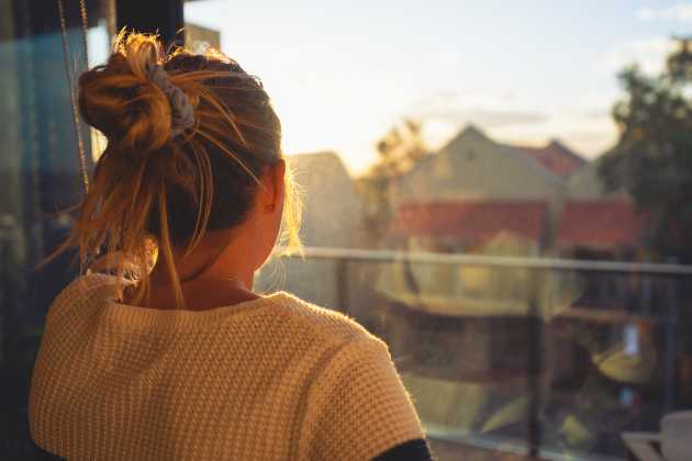 woman at window getty image