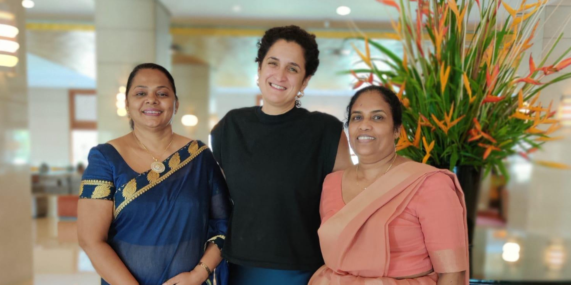 RCN staff member Elsa stood smiling with head PHNO nurses in Sri Lanka