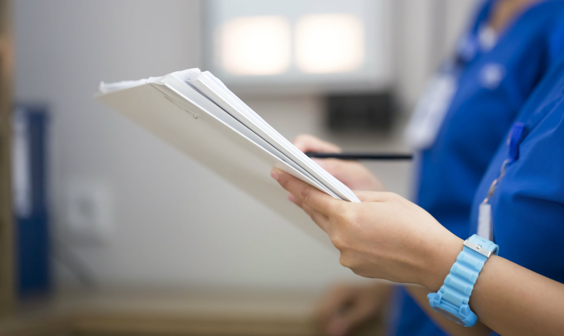 Nurses looking at paperwork