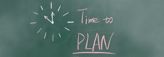 chalkboard with chalk drawing of clock and the words "time to plan"