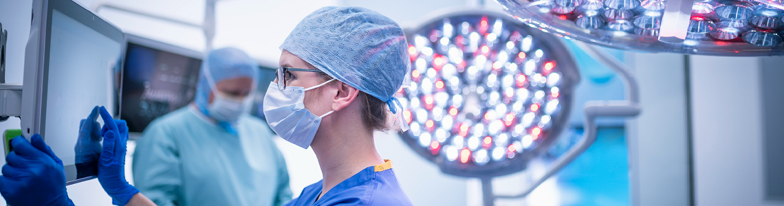 surgical nurse viewing a computer screen