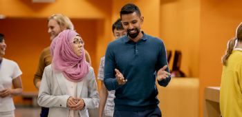 Man and woman walking in corridor