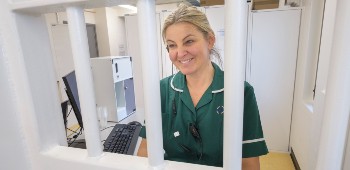 Healthcare professional dispensing medicine in prison