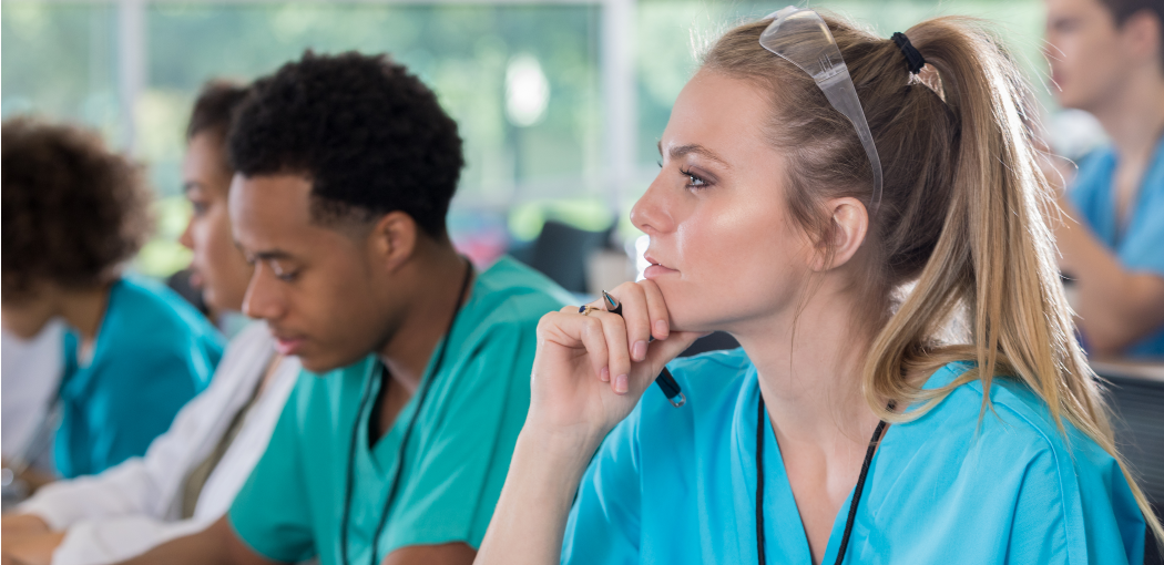 Group of student nurses in class sat at their desk