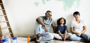 Young family sitting on floor