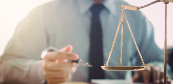 man sitting behind weighing scale