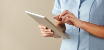 Nurse with tablet computer