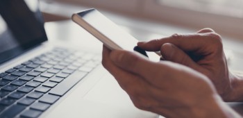 Person holding a mobile phone