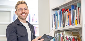 RCN Member in library