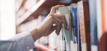 Pulling book off shelf