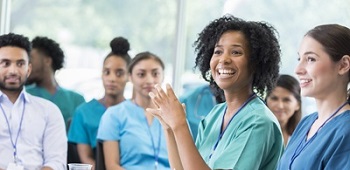 Forum with nurses smiling
